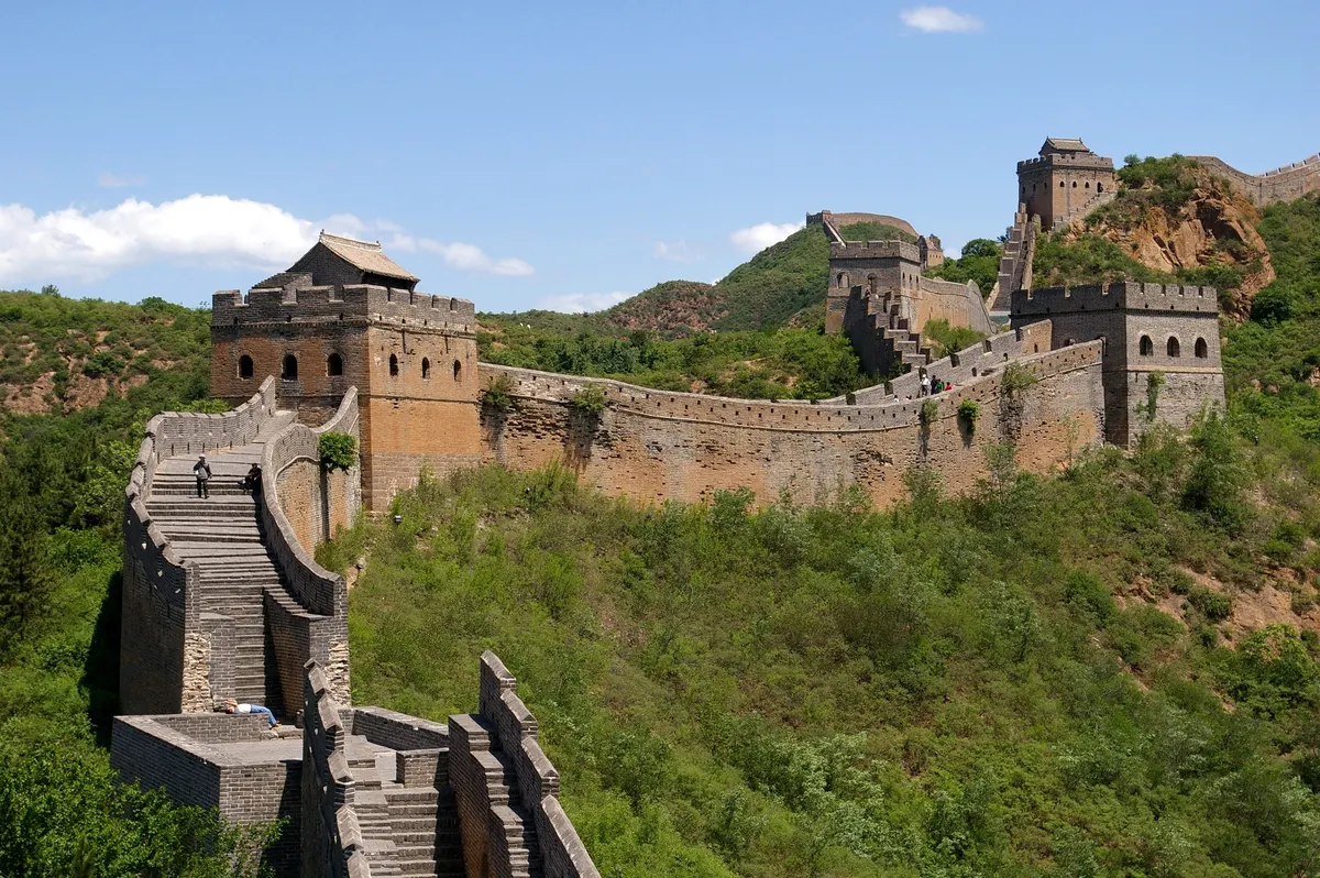 Great Wall of China winding over green mountains in April