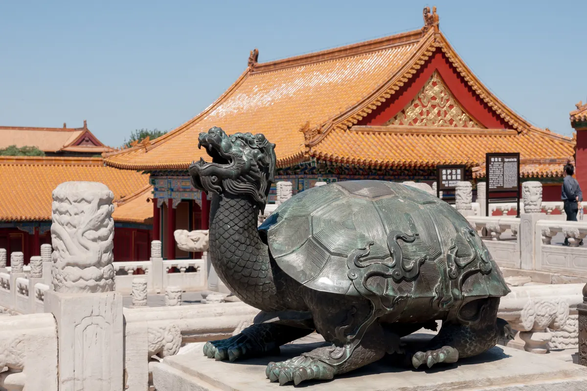 Forbidden City rooftops in Beijing under clear blue autumn sky