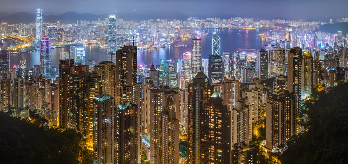 Hong Kong Victoria Harbour skyline illuminated at night